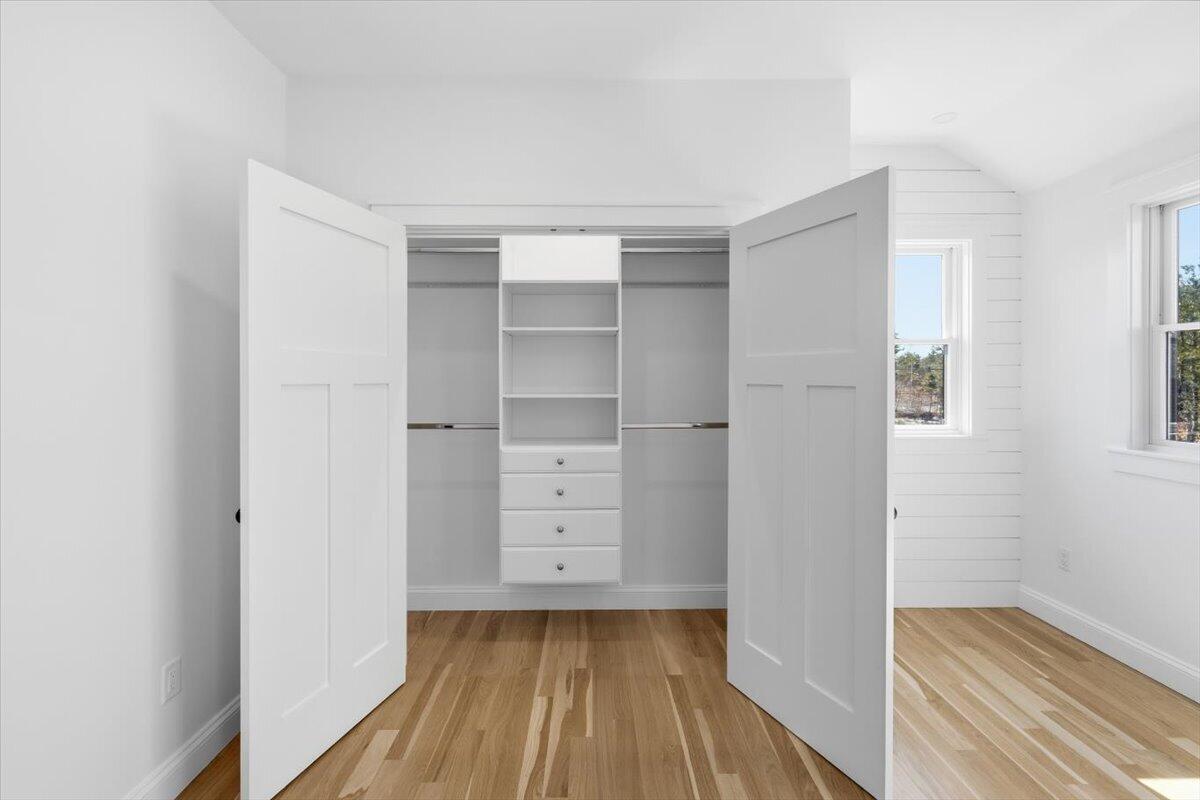 58 Old Chatham Road Brewster, MA 02631 - Photo 27 of 38 a view of walk in closet with wooden floor