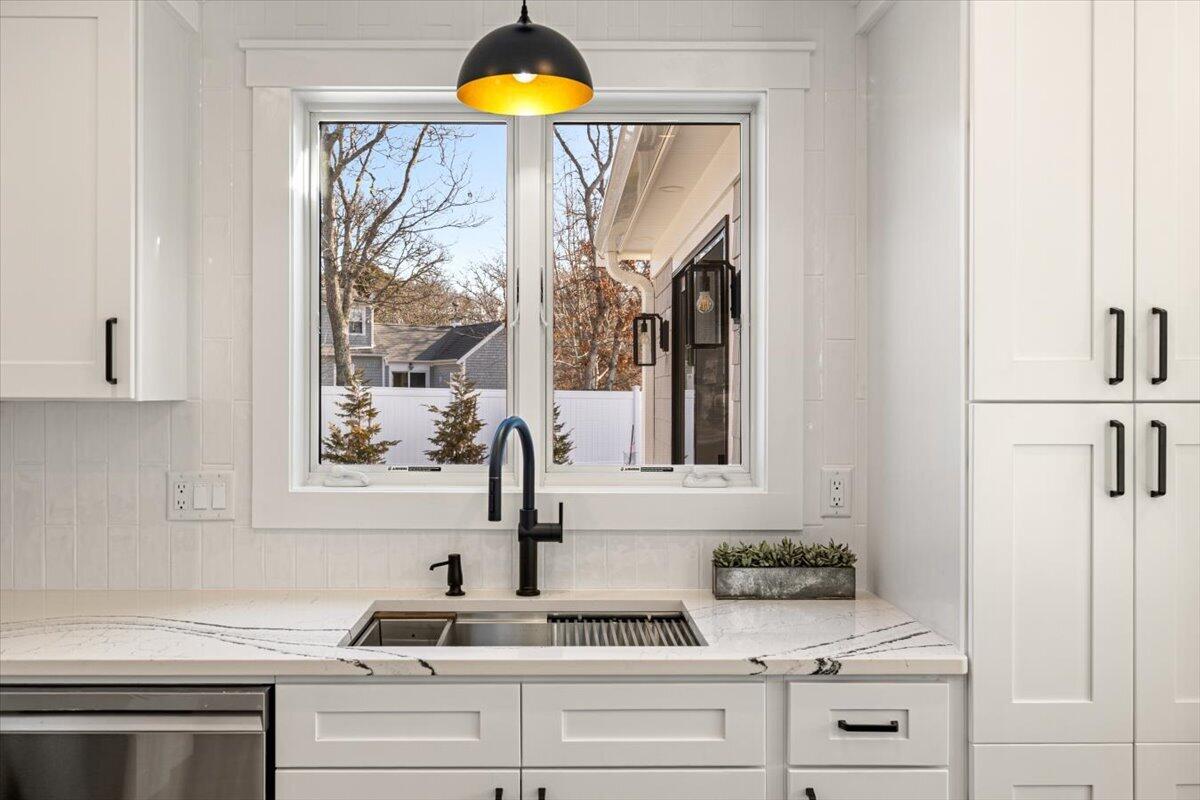 58 Old Chatham Road Brewster, MA 02631 - Photo 8 of 38 a kitchen with a sink and a window