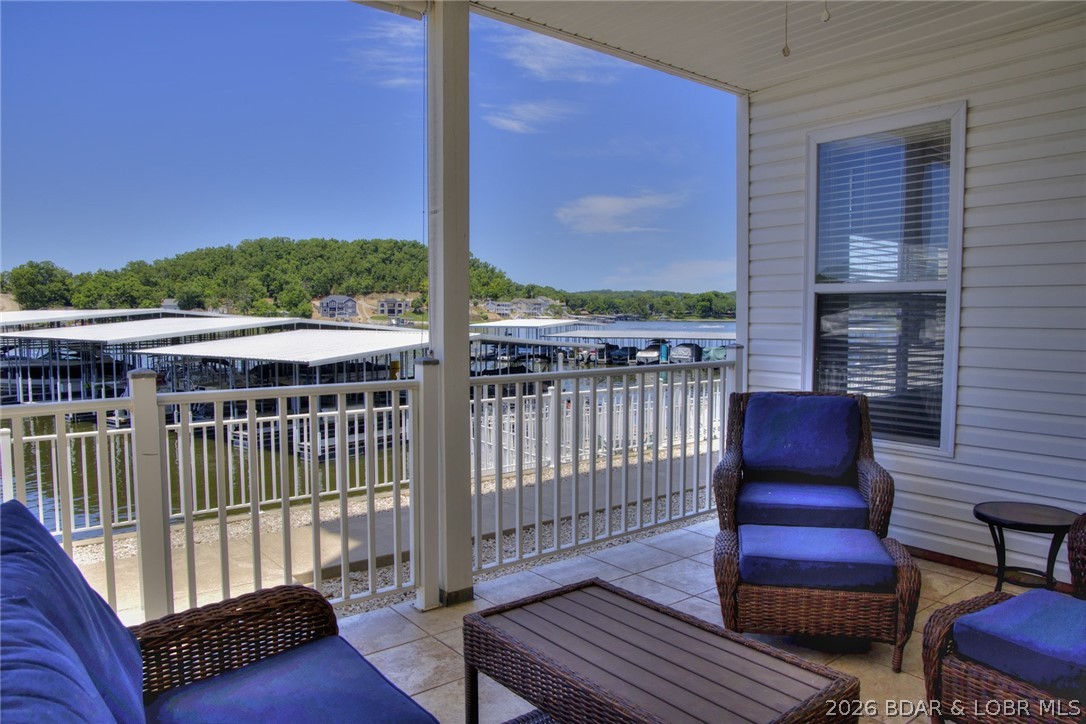 275 Flynn Road, Unit 106 Lake Ozark, MO 65049 - Photo 25 of 39 Lower level deck provides privacy for guests with