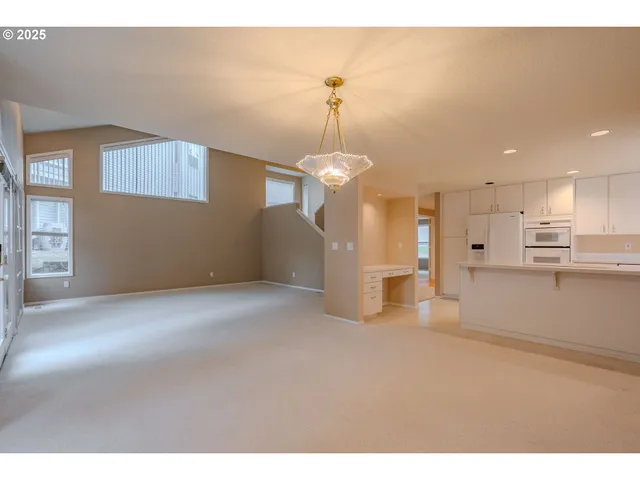 a view of a kitchen with a sink and dishwasher