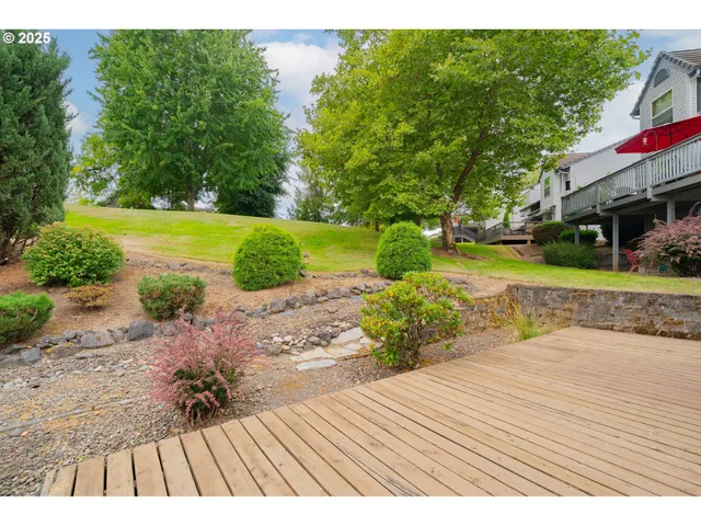 a front view of a house with a garden and plants