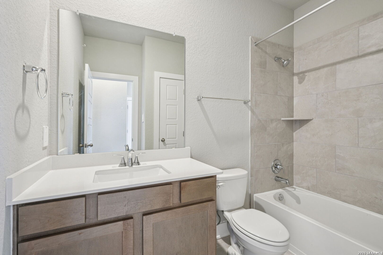 109 Dakota Ridge Cibolo, TX 78108 - Photo 18 of 38 a bathroom with a sink toilet vanity and shower