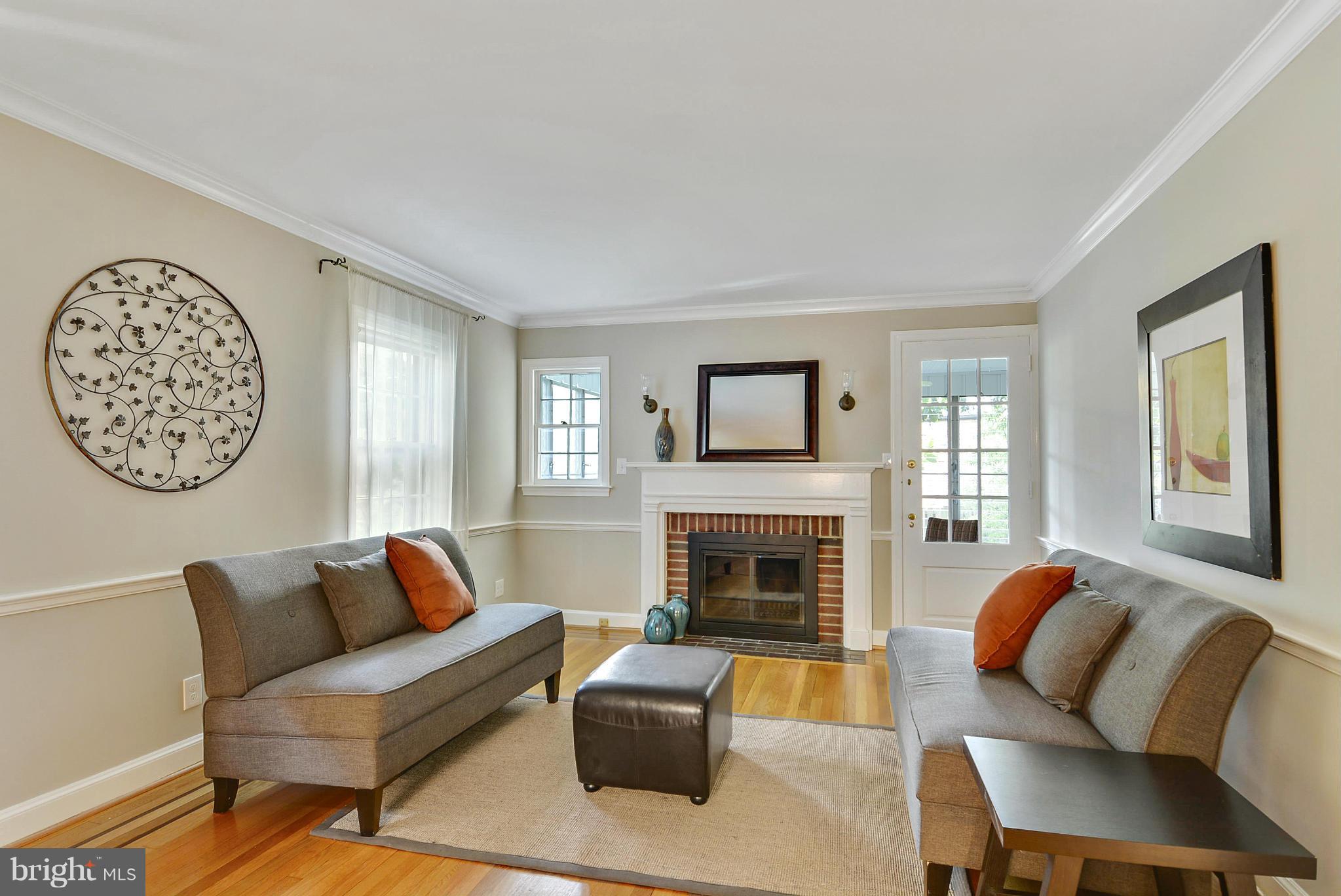 619 Greenbrier Drive Silver Spring, MD 20910 - Photo 2 of 30 a living room with furniture and a fireplace
