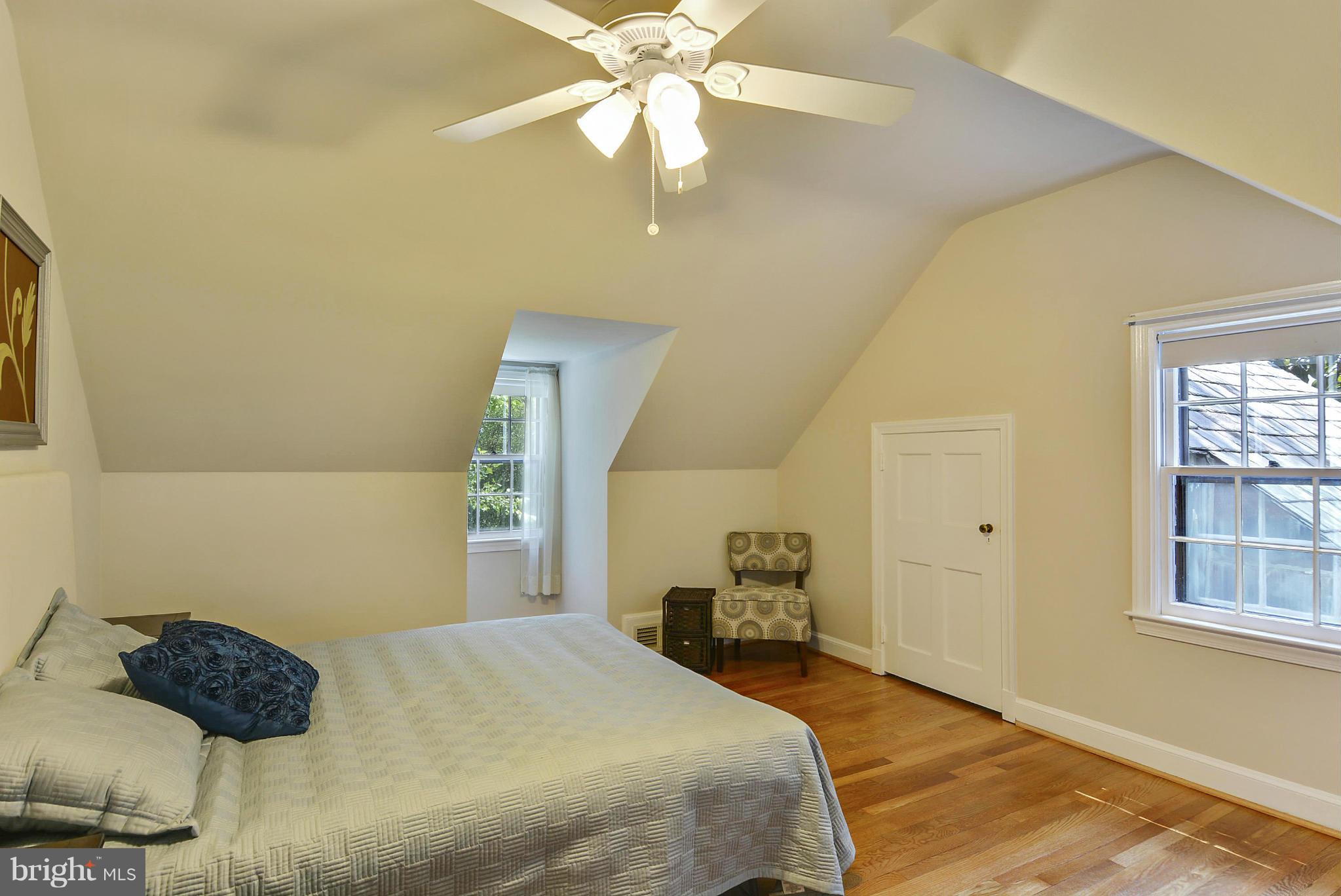 619 Greenbrier Drive Silver Spring, MD 20910 - Photo 15 of 30 a bedroom with a bed and a chandelier