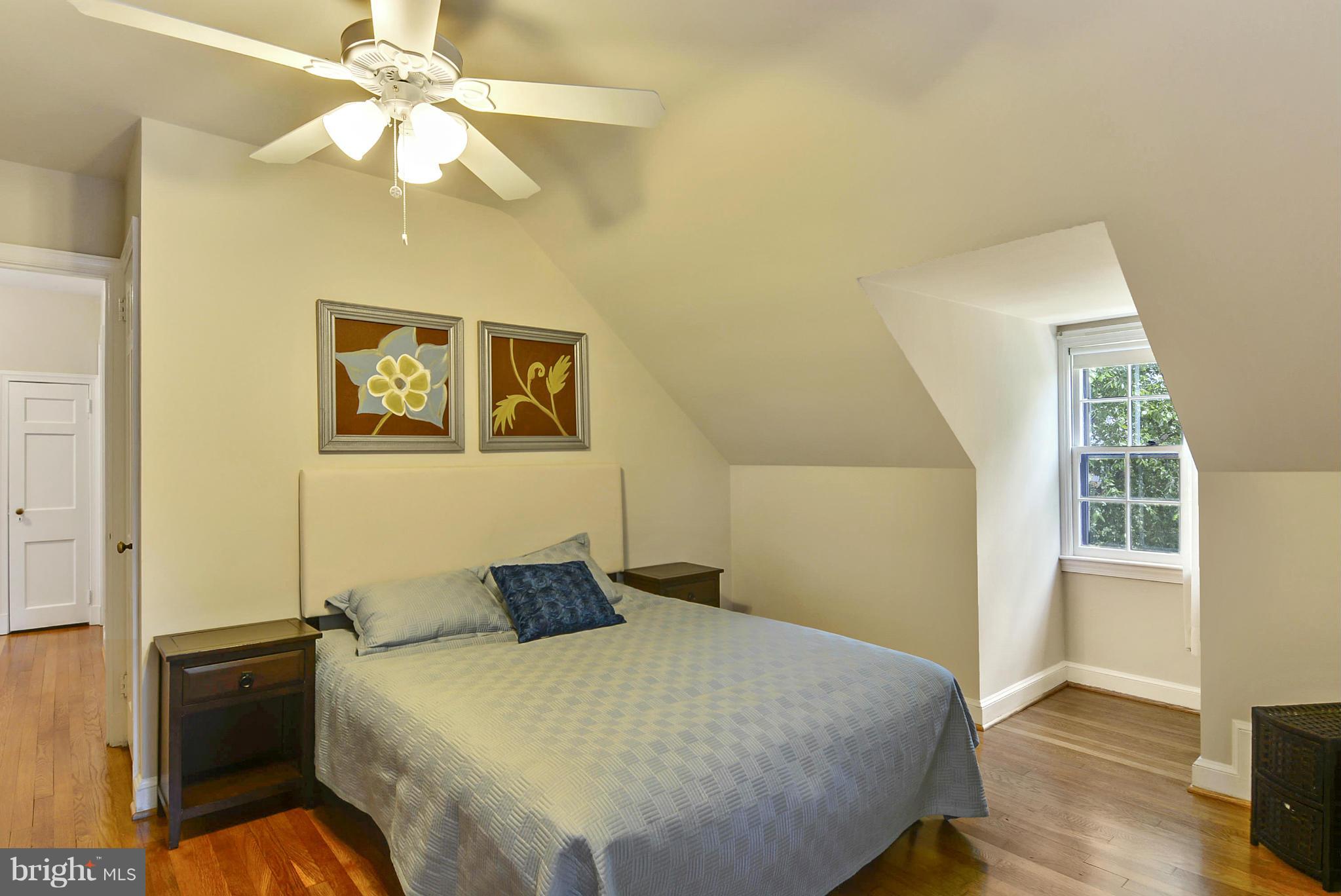 619 Greenbrier Drive Silver Spring, MD 20910 - Photo 16 of 30 a bedroom with a bed and wooden floor