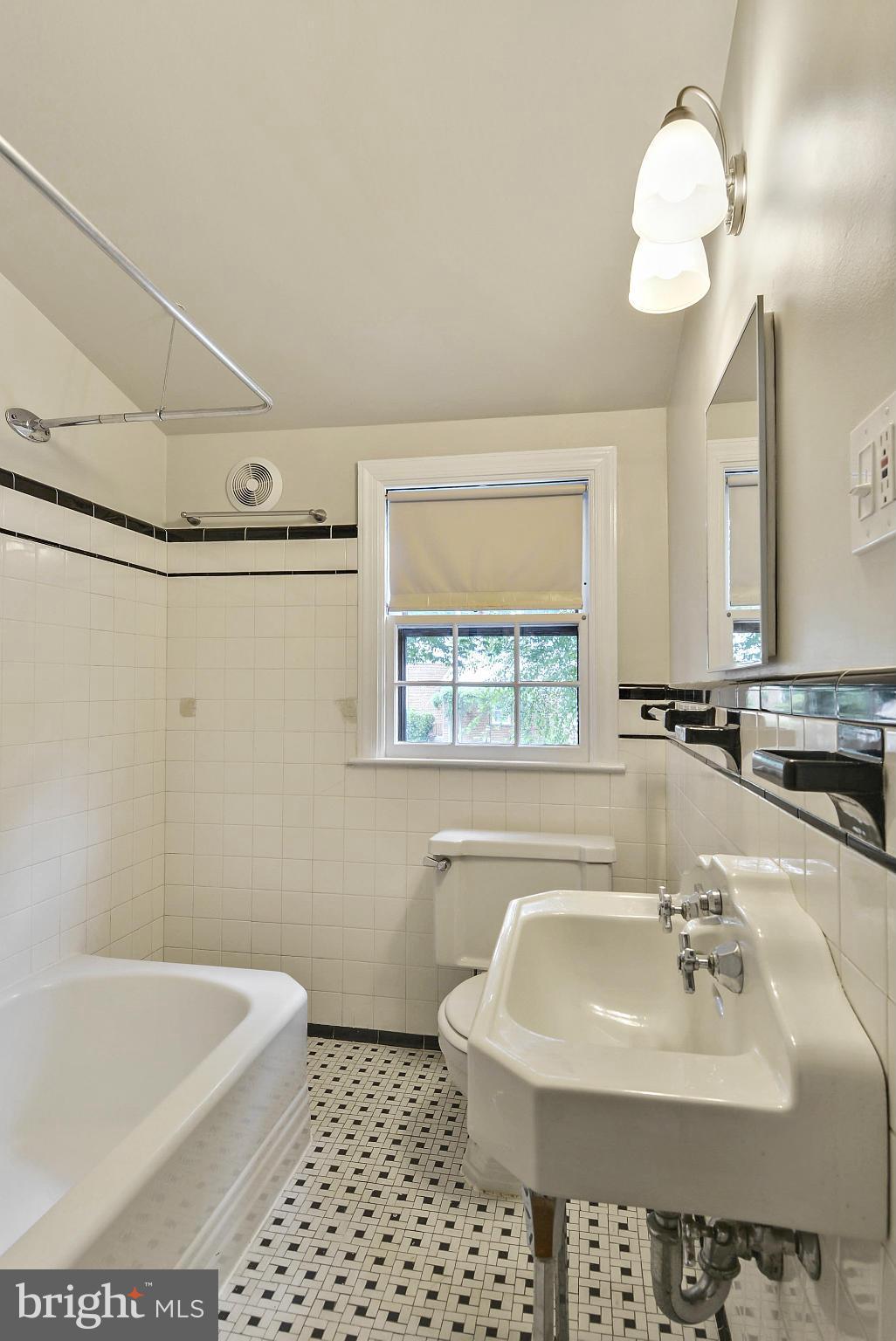 619 Greenbrier Drive Silver Spring, MD 20910 - Photo 19 of 30 a bathroom with a sink a toilet and a bathtub