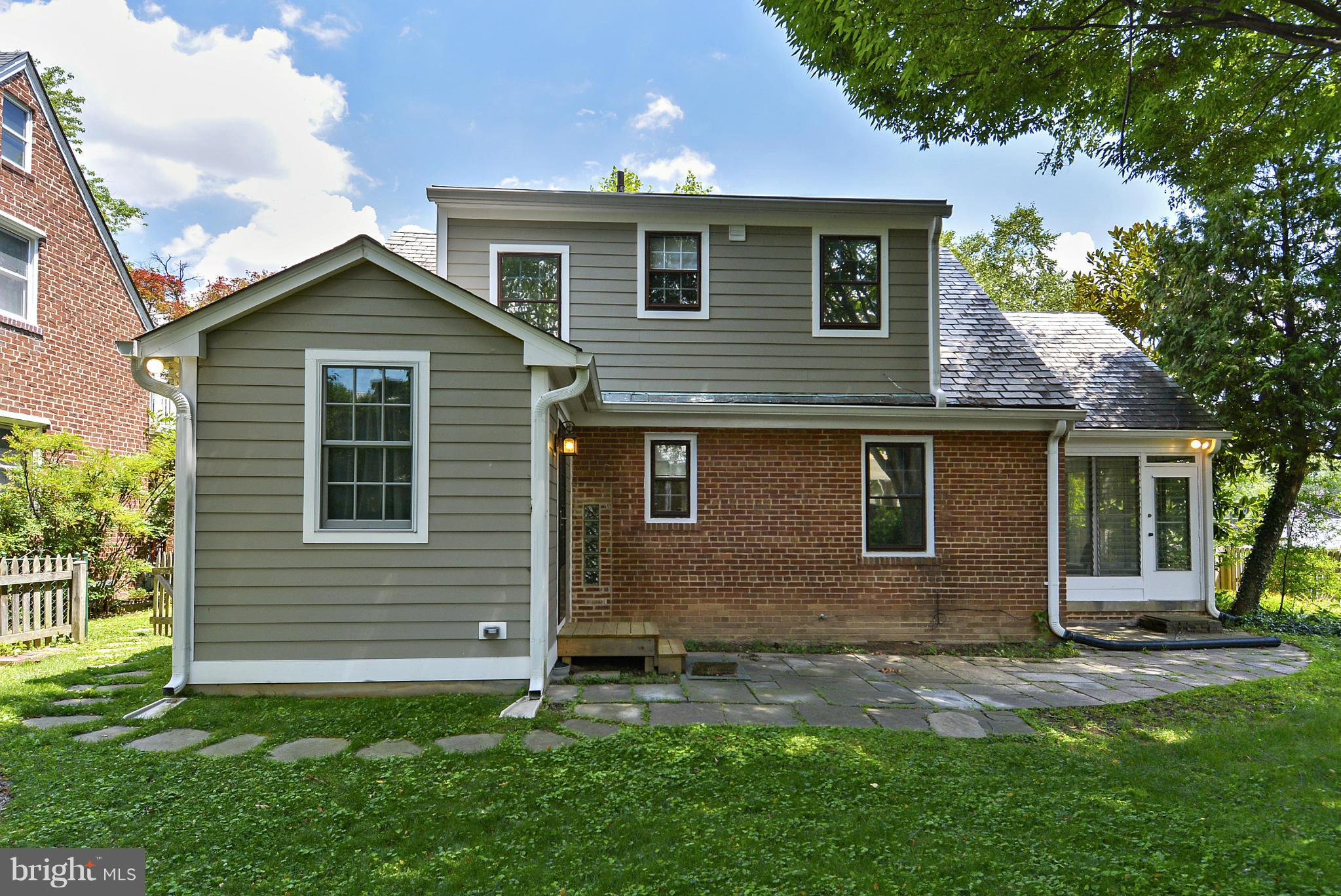 619 Greenbrier Drive Silver Spring, MD 20910 - Photo 26 of 30 a front view of a house with a yard and garage