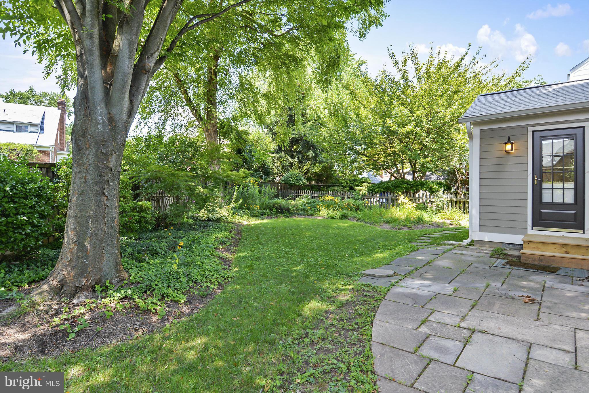 619 Greenbrier Drive Silver Spring, MD 20910 - Photo 27 of 30 a view of a yard in front of a house with plants and large trees