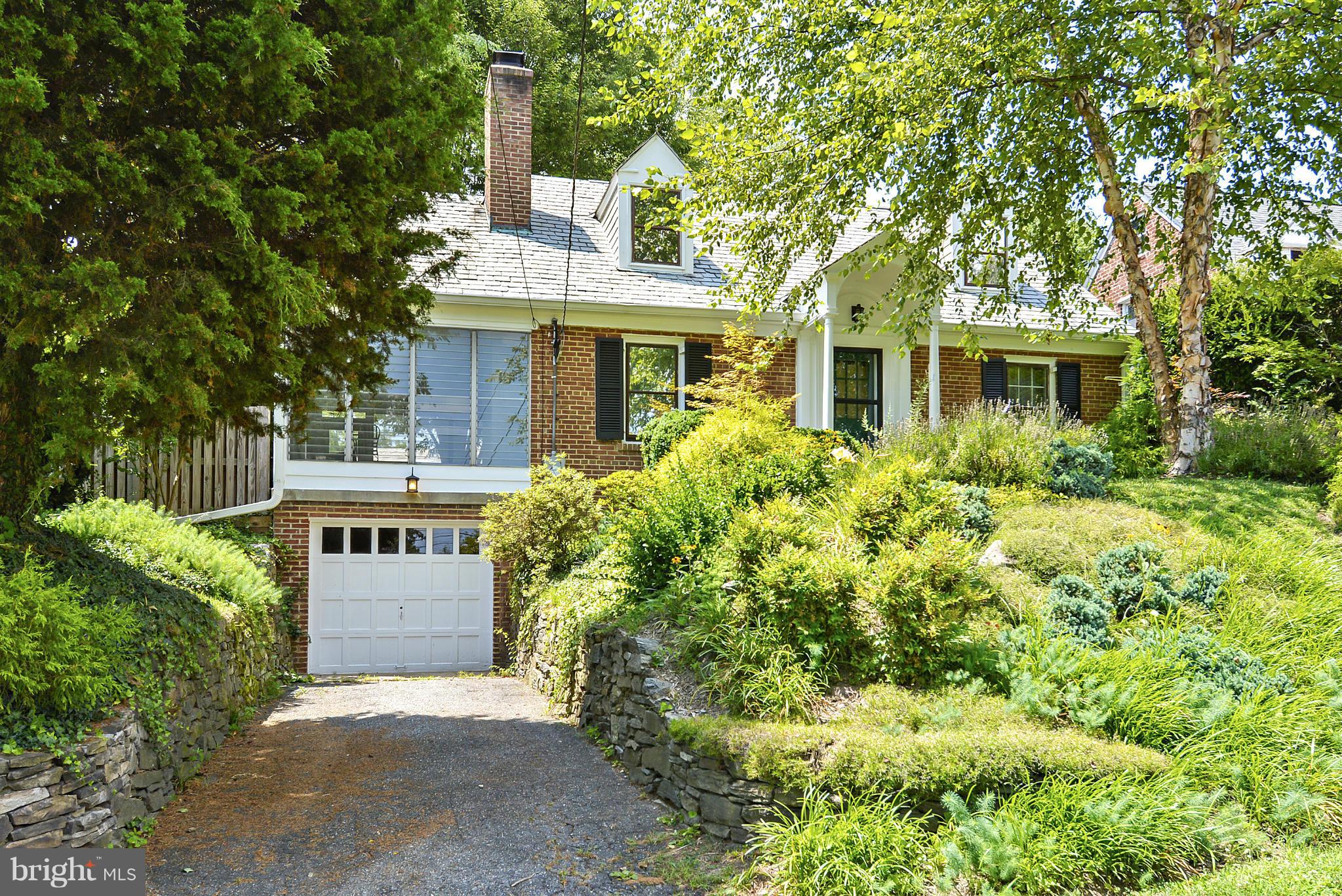 619 Greenbrier Drive Silver Spring, MD 20910 - Photo 30 of 30 a front view of a house with a garden
