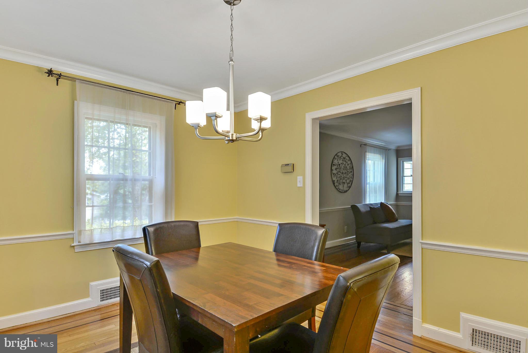 619 Greenbrier Drive Silver Spring, MD 20910 - Photo 5 of 30 a view of a dining room with furniture wooden floor and chandelier