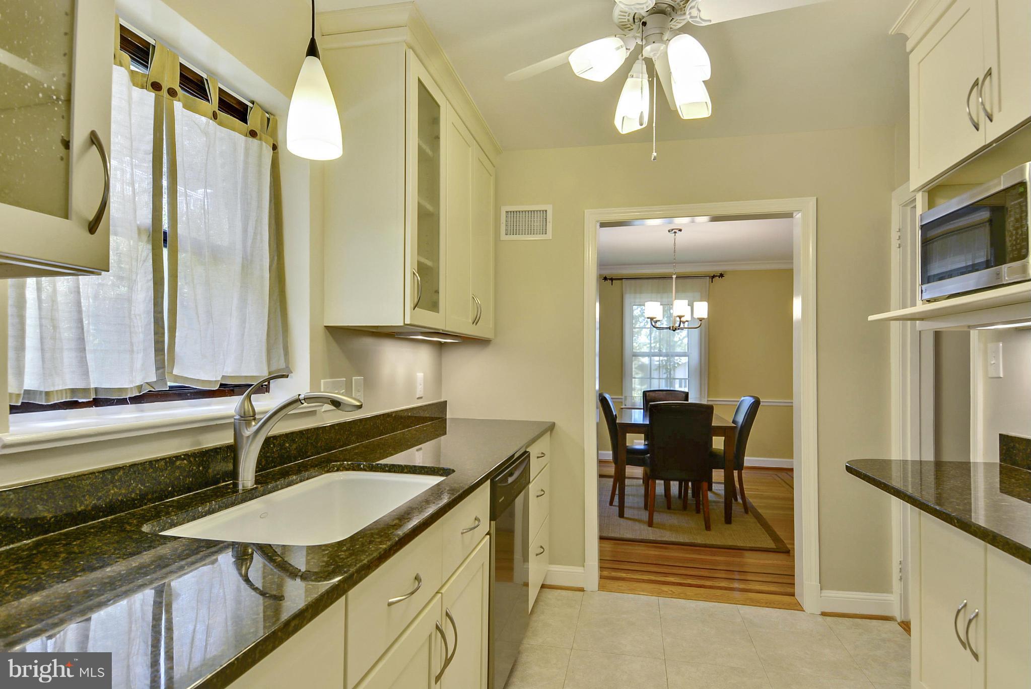 619 Greenbrier Drive Silver Spring, MD 20910 - Photo 7 of 30 a kitchen with a sink and cabinets