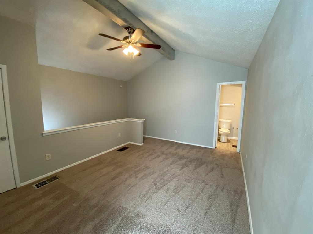 9696 Walnut Street, Unit 708 Dallas, TX 75243 - Photo 7 of 10 an empty room with windows and fan