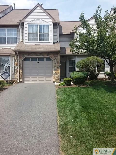 218 Nebula Road Piscataway, NJ 08854 - Photo 1 of 15 a front view of a house with a garden and trees