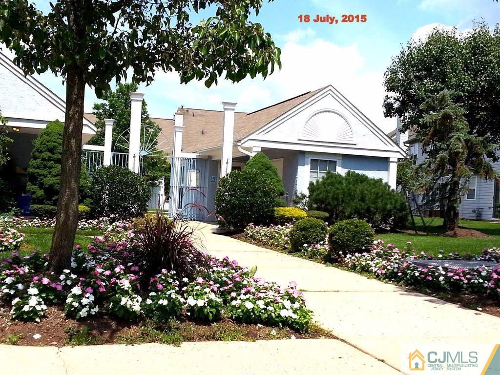 218 Nebula Road Piscataway, NJ 08854 - Photo 15 of 15 a front view of a house with a yard and fountain