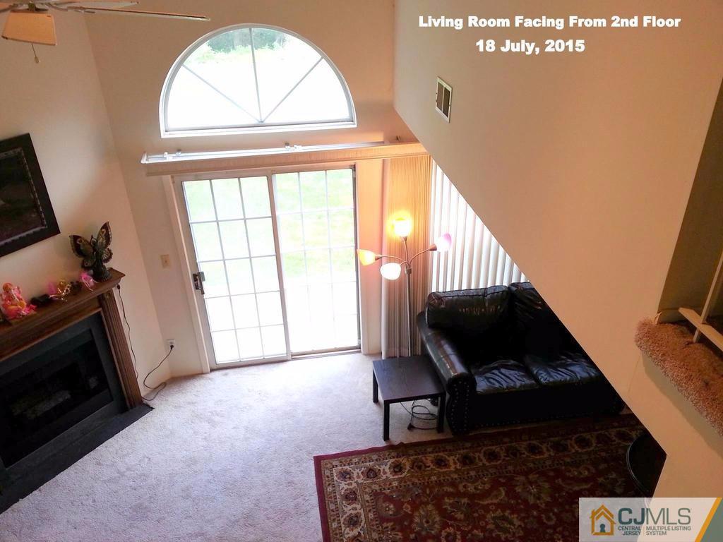 218 Nebula Road Piscataway, NJ 08854 - Photo 8 of 15 a living room with furniture and a fireplace