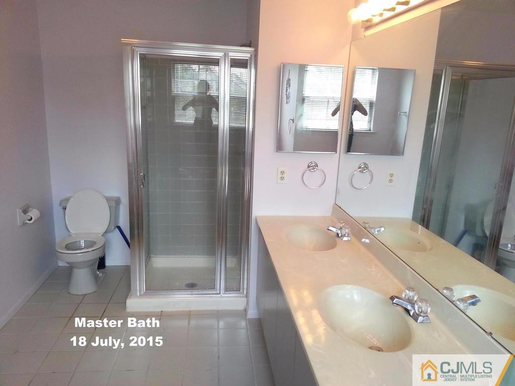 218 Nebula Road Piscataway, NJ 08854 - Photo 10 of 15 a bathroom with a sink toilet and shower