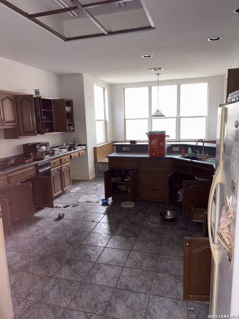 10520 Highway 281 Spring Branch, TX 78070 - Photo 11 of 11 a kitchen with stainless steel appliances granite countertop a stove sink and cabinets