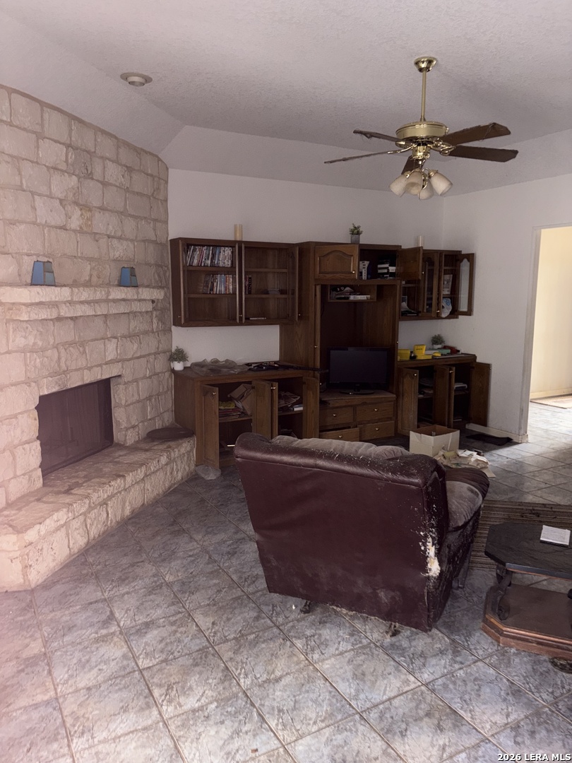 10520 Highway 281 Spring Branch, TX 78070 - Photo 7 of 11 a living room with furniture and a fireplace