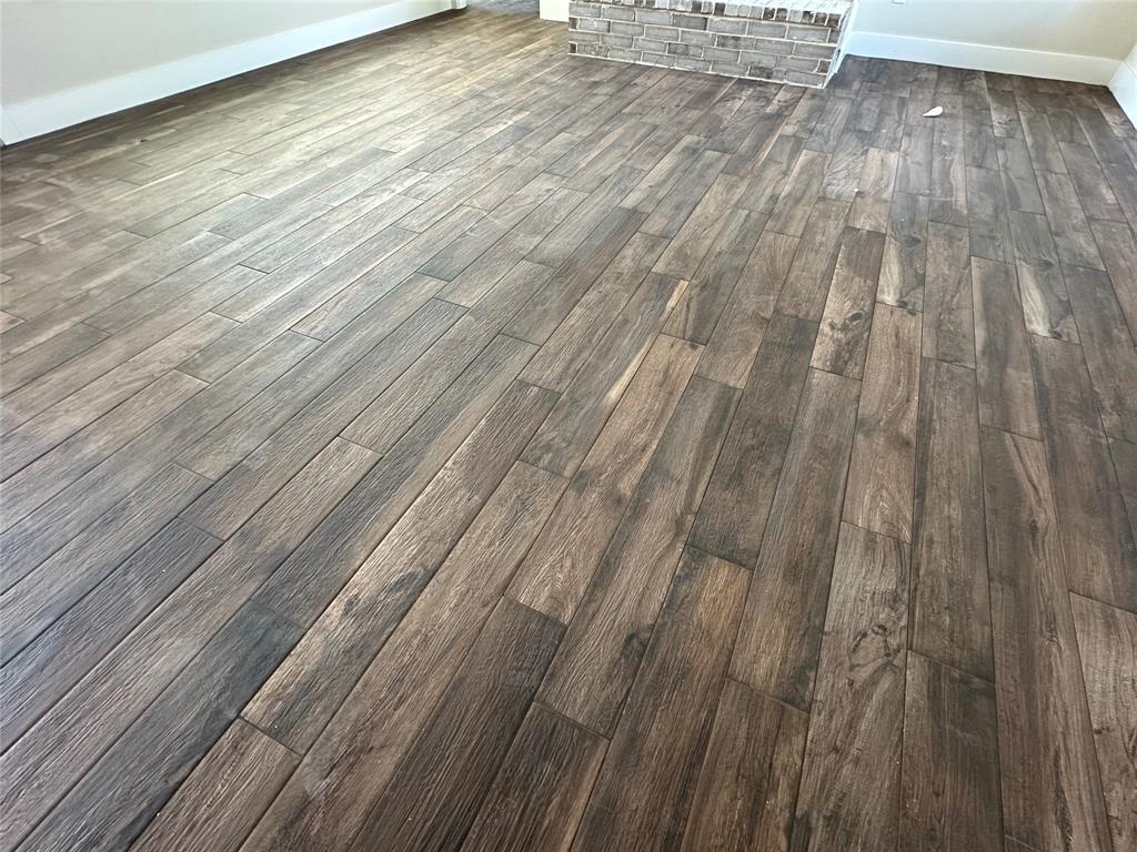 2000 Collin Street Weatherford, TX 76085 - Photo 8 of 13 Gorgeous wood-look tile throughout
