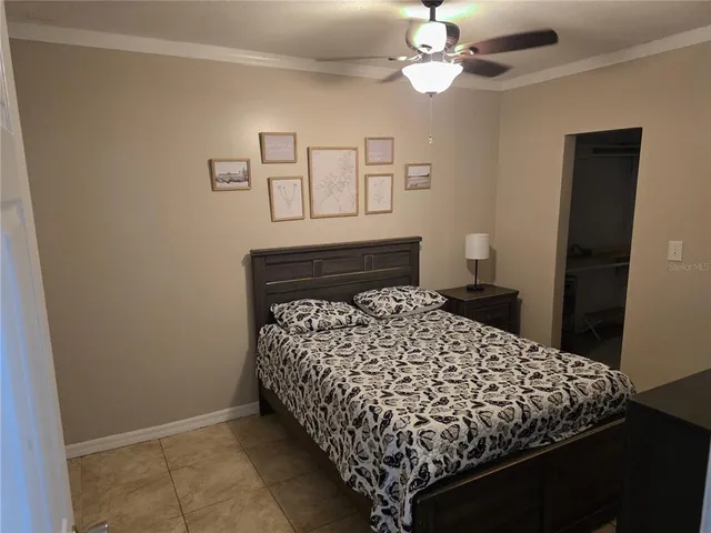 a bedroom with bed and a window