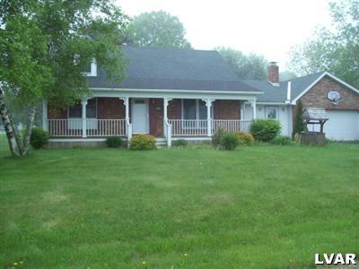 545 Bauer Road Bath, PA 18014 - Photo 1 of 10 a front view of a house with a yard and trees