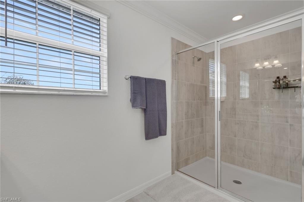 2187 Cara Cara Way Naples, FL 34120 - Photo 21 of 50 Full bathroom featuring a stall shower and ornamental molding