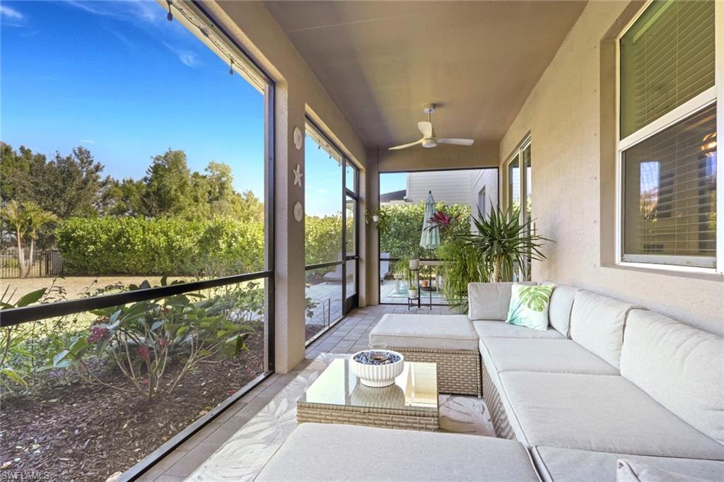 2187 Cara Cara Way Naples, FL 34120 - Photo 26 of 50 Sunroom featuring an outdoor living space and ceiling fan