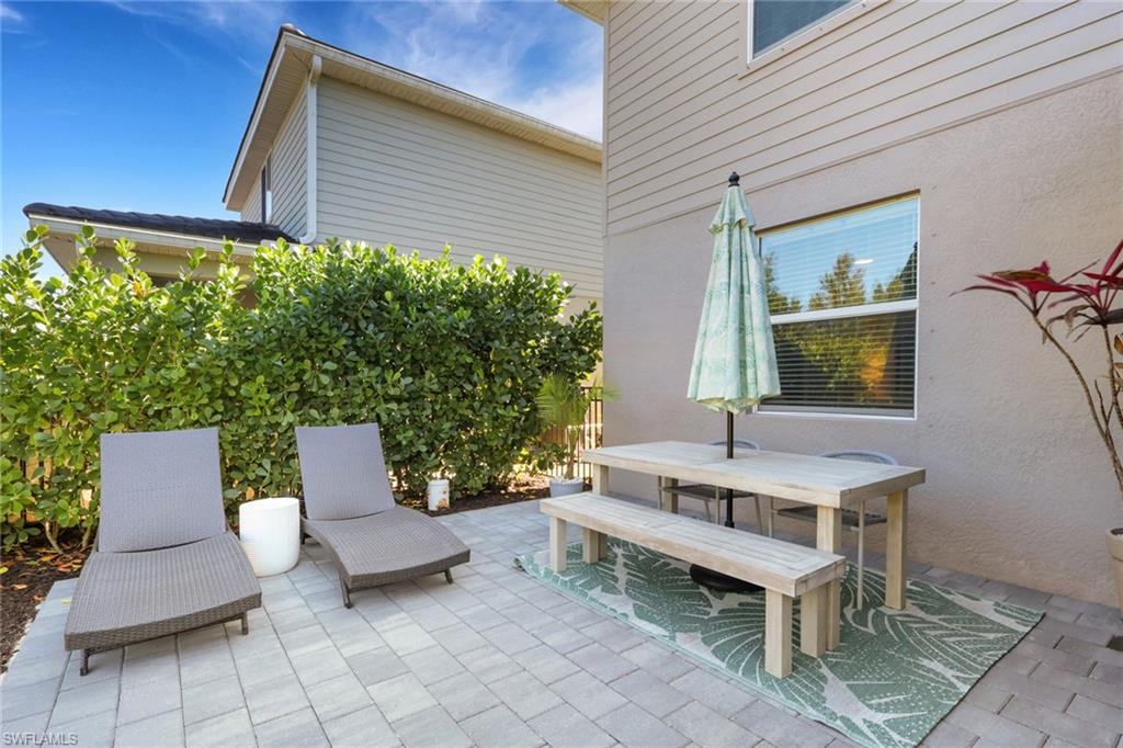 2187 Cara Cara Way Naples, FL 34120 - Photo 27 of 50 View of patio / terrace with outdoor dining space