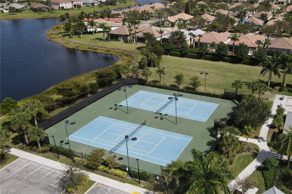 2187 Cara Cara Way Naples, FL 34120 - Photo 45 of 50 Aerial perspective of suburban area featuring a nearby body of water