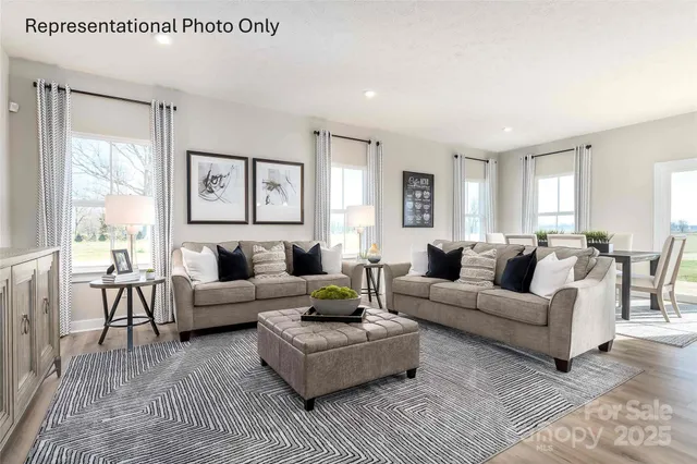 a living room with furniture and windows