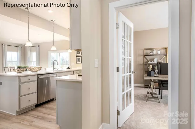 a kitchen with a refrigerator and a sink