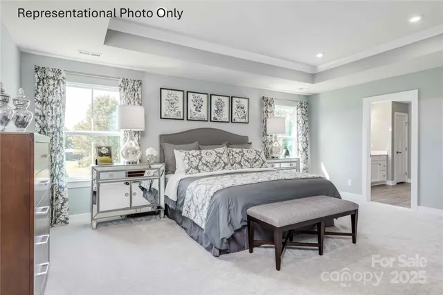 a spacious bedroom with a bed and a window