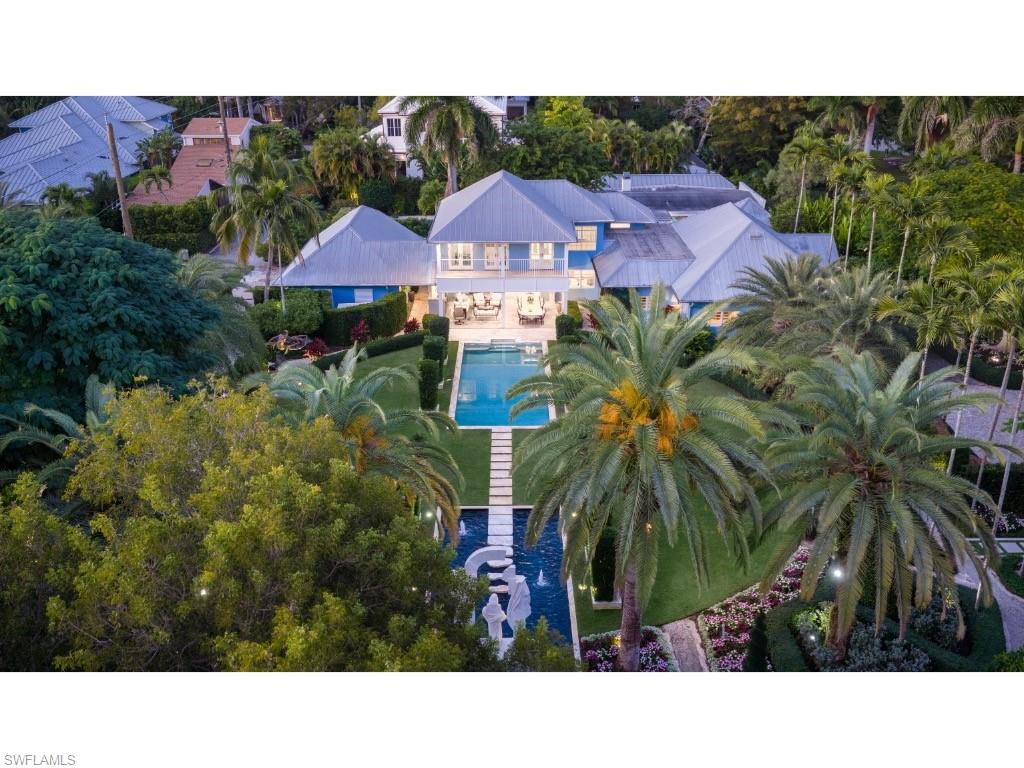 247 6th Street North Naples, FL 34102 - Photo 24 of 30 a black and white house with a yard