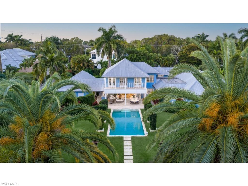 247 6th Street North Naples, FL 34102 - Photo 4 of 30 a black and white photo of a garden