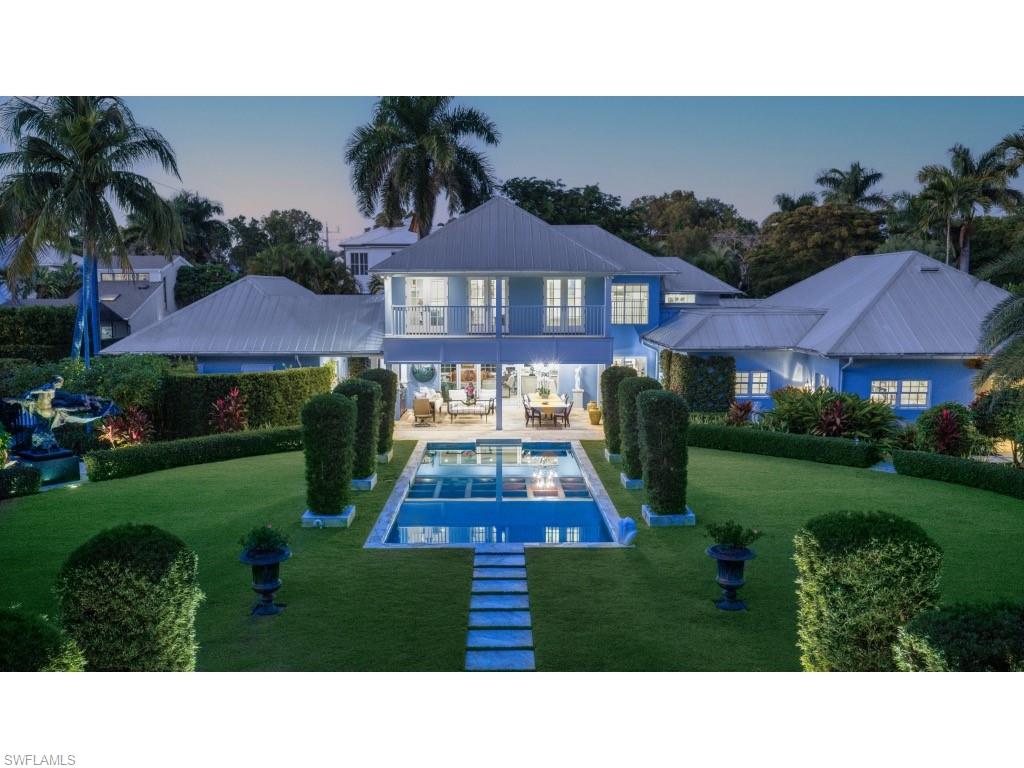 247 6th Street North Naples, FL 34102 - Photo 6 of 30 a view of house with garden space and street view
