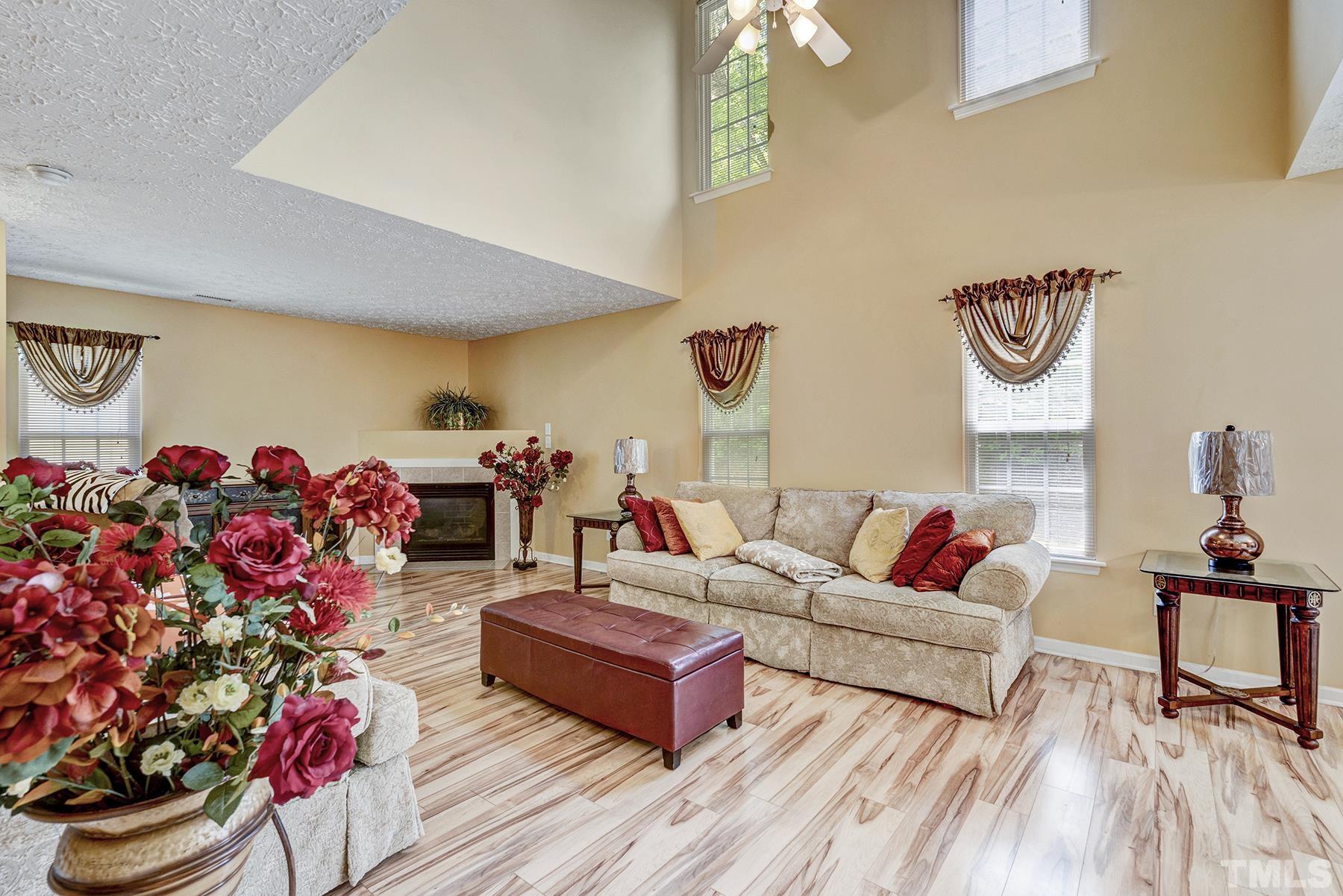 5712 Forest Point Road Raleigh, NC 27610 - Photo 13 of 23 a living room with furniture and a couch