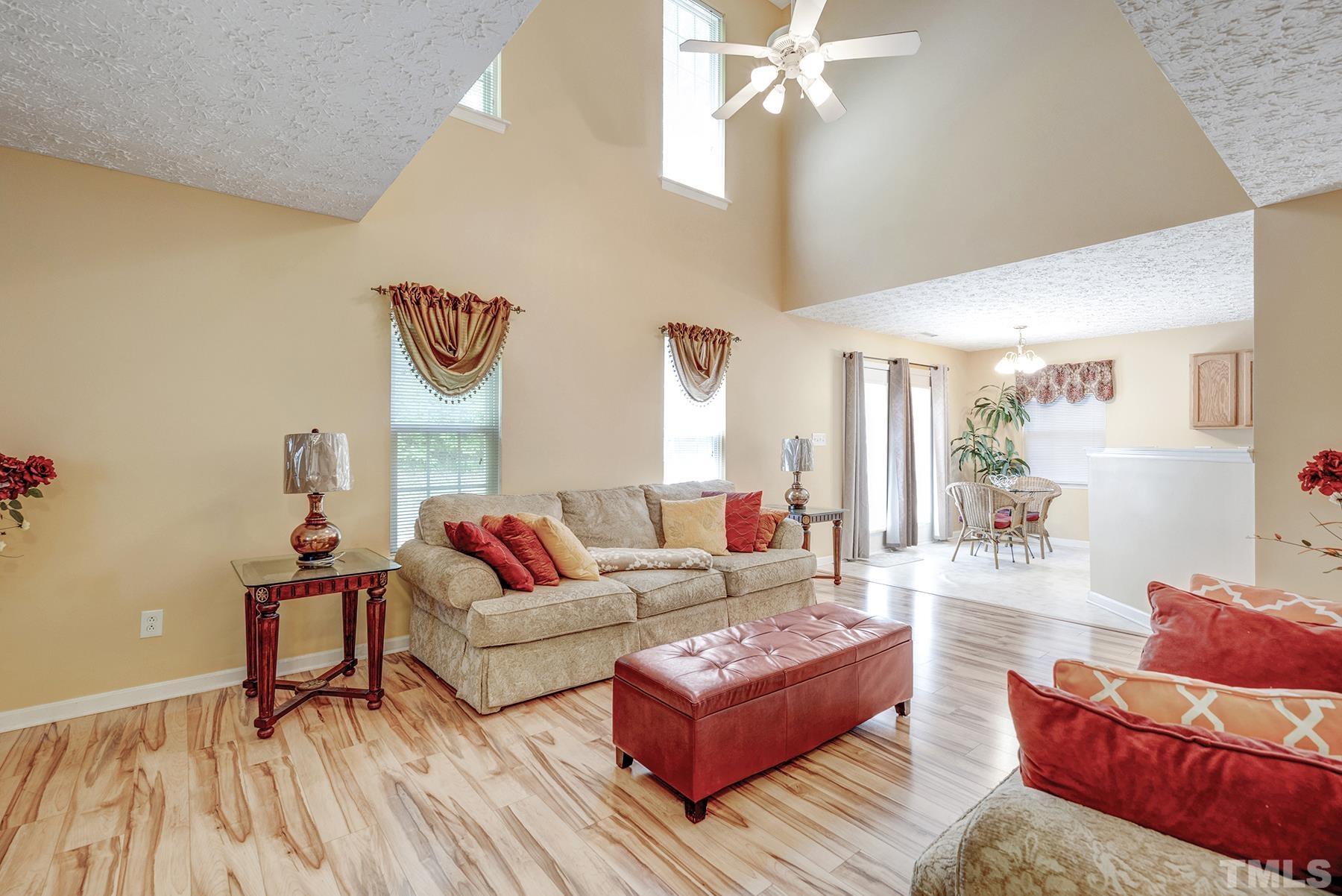 5712 Forest Point Road Raleigh, NC 27610 - Photo 14 of 23 a living room with furniture and wooden floor