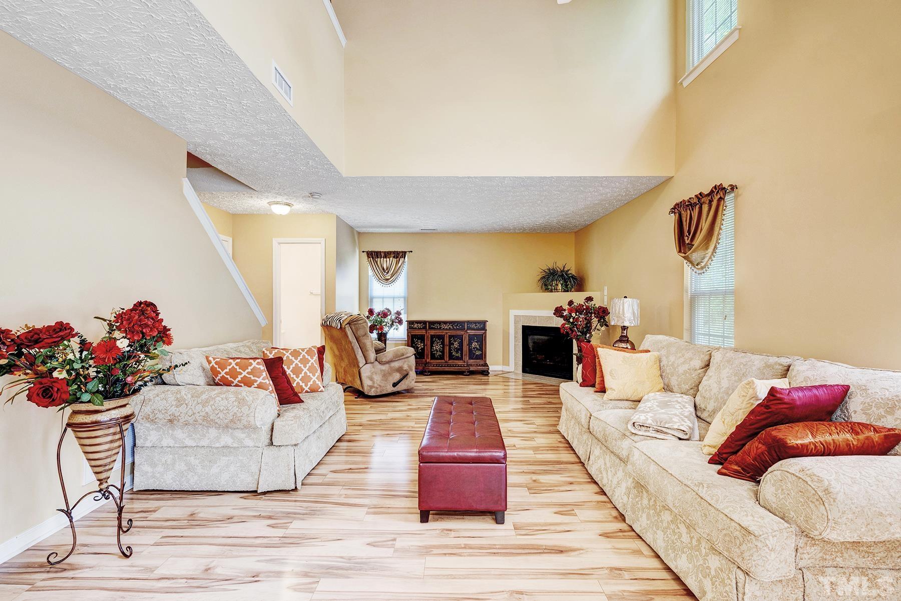 5712 Forest Point Road Raleigh, NC 27610 - Photo 16 of 23 a living room with furniture and a potted plant