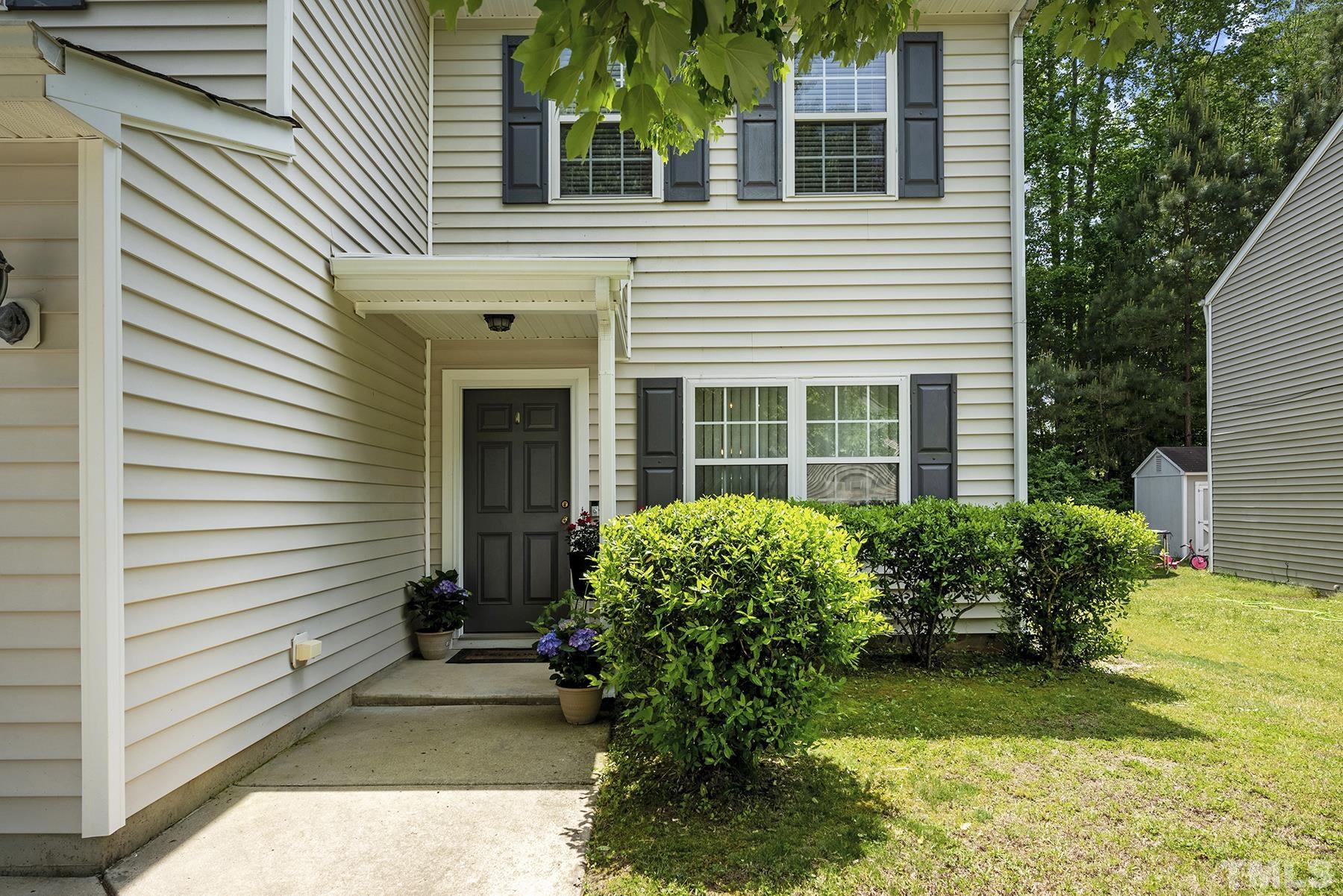 5712 Forest Point Road Raleigh, NC 27610 - Photo 2 of 23 a front view of a house with garden