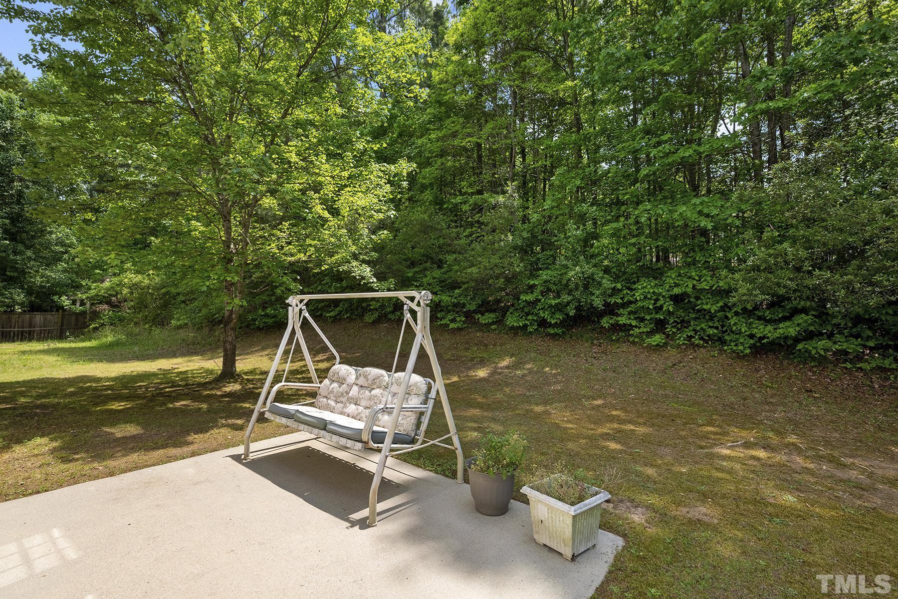 5712 Forest Point Road Raleigh, NC 27610 - Photo 4 of 23 a view of a swimming pool with lounge chair