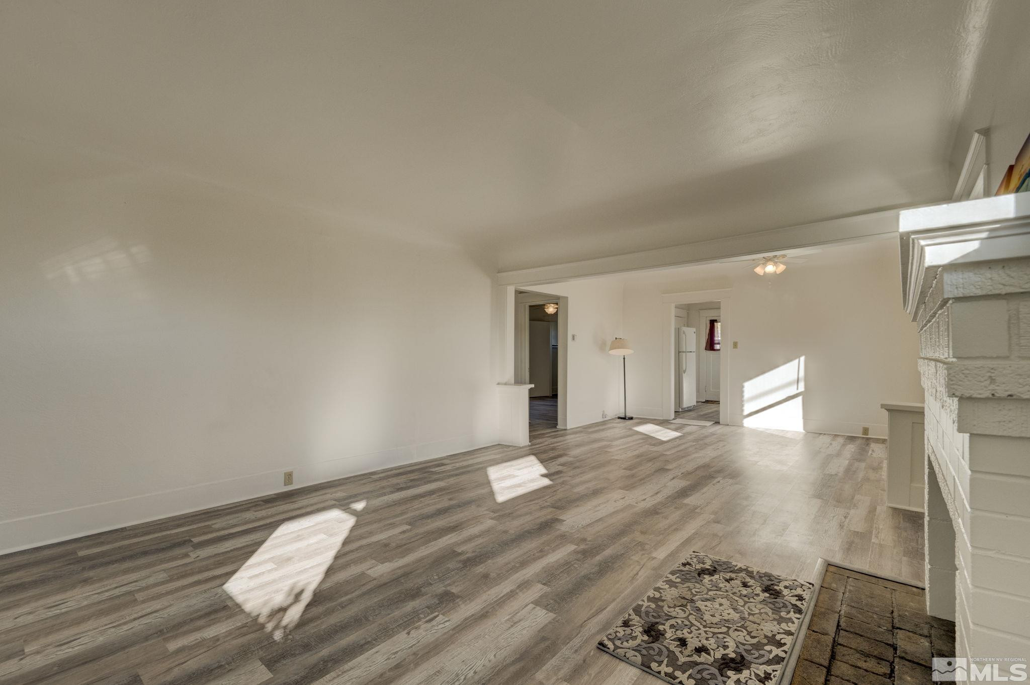 1102 Codel Way Reno, NV 89503 - Photo 6 of 33 a view of empty room with wooden floor