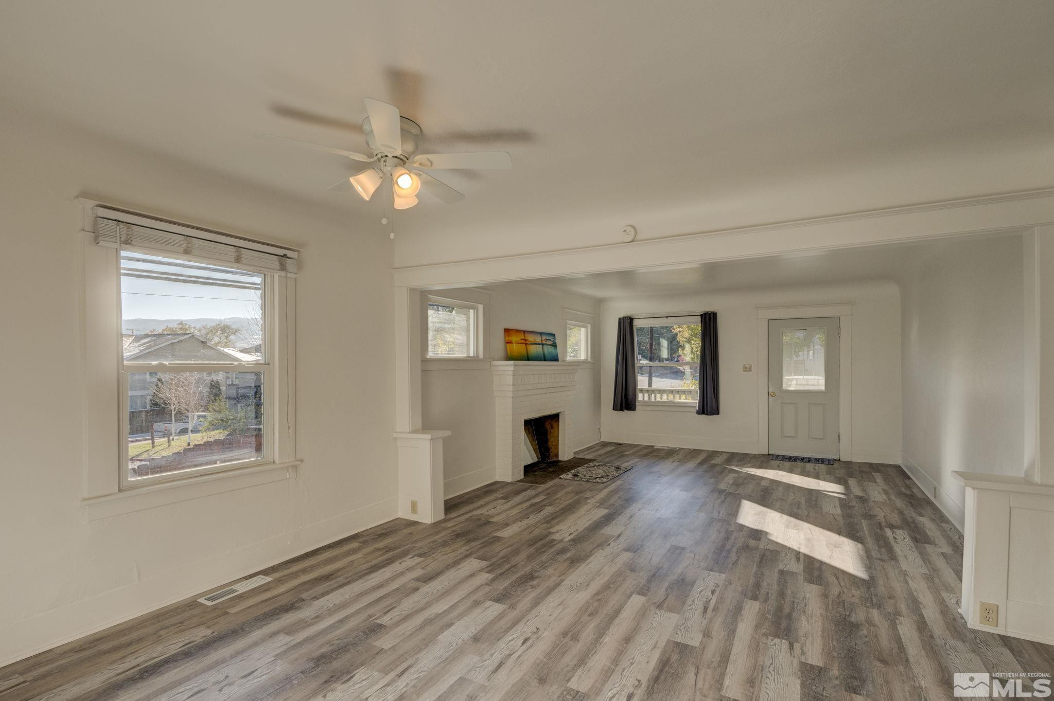 1102 Codel Way Reno, NV 89503 - Photo 7 of 33 a view of empty room with wooden floor and fan