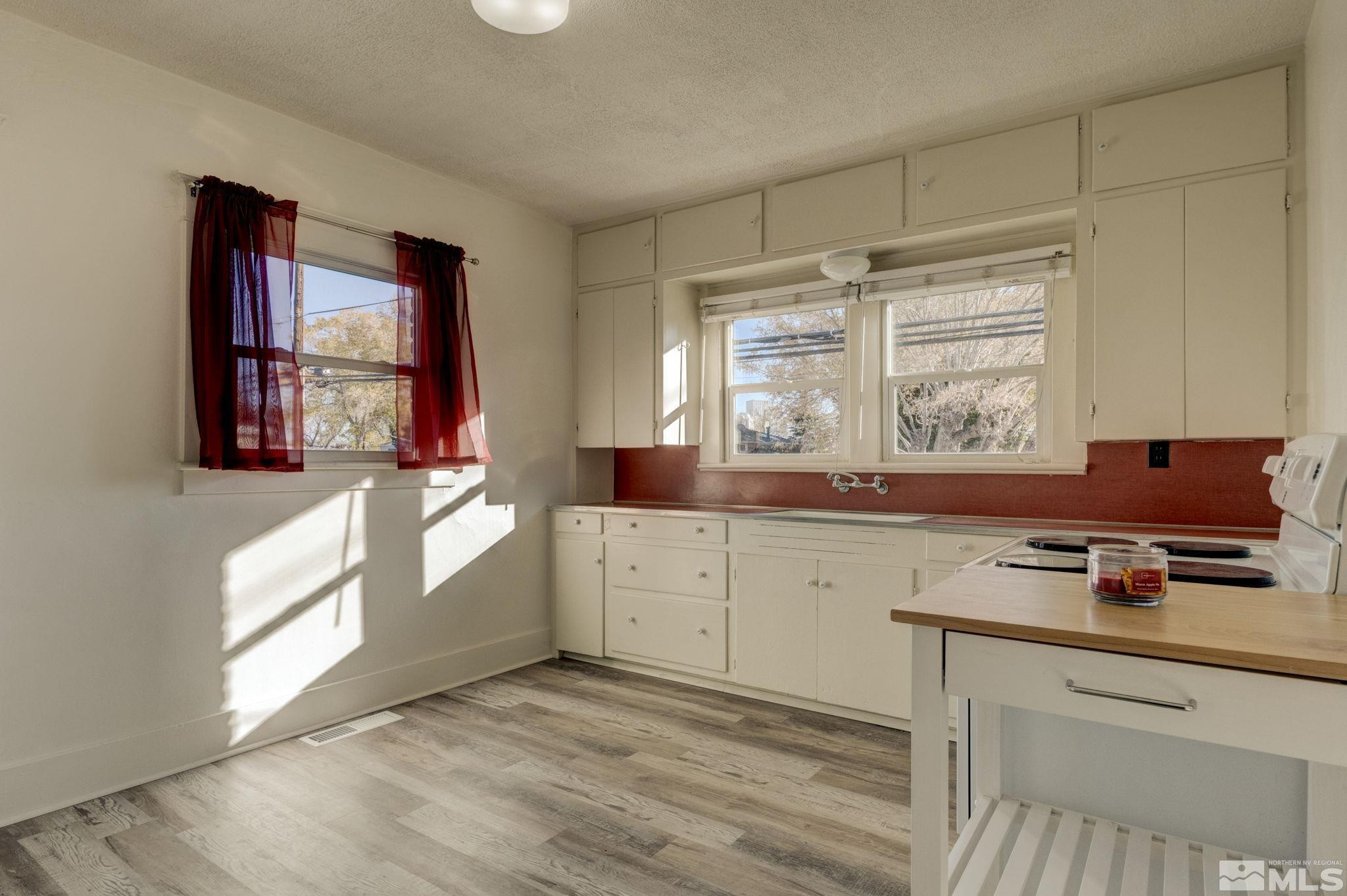 1102 Codel Way Reno, NV 89503 - Photo 8 of 33 a kitchen with a stove a sink and a window
