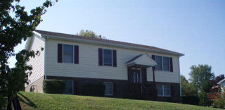 107 Ox Road Waynesboro, VA 22980 - Photo 1 of 1 a front view of a house with a garden