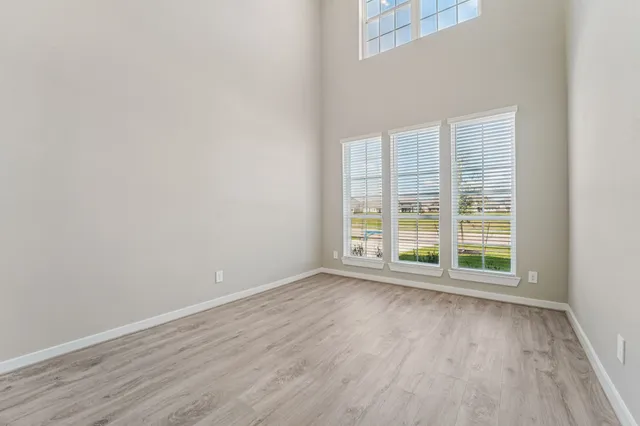 wooden floor and window in an empty room