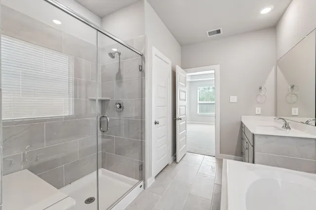 a bathroom with a shower and a sink