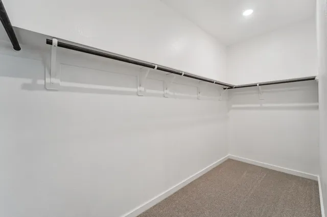 a view of an empty walk in closet