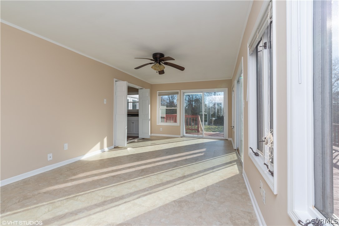 8329 Peaks Road Hanover, VA 23069 - Photo 17 of 25 a view of a livingroom with a ceiling fan and window