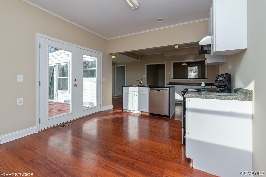8329 Peaks Road Hanover, VA 23069 - Photo 7 of 25 a kitchen with stainless steel appliances a stove top oven a sink and a microwave