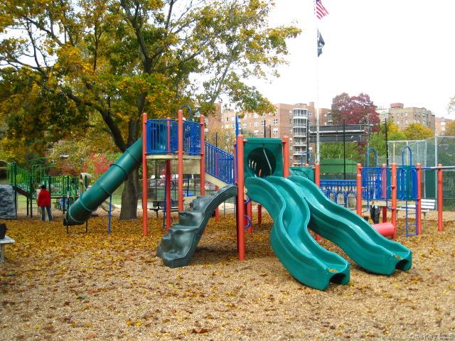 143 Garth Road, Unit 4P Scarsdale, NY 10583 - Photo 40 of 44 Garth Road Playground - Garth Road is a self contained tree lined street and 1/2 mile long starting at the Scarsdale Metro North Train Station and ending at the ball field. Easy walk to Scarsdale village and train. It's only a 33 minute train ride to Grand Central Terminal. As a resident you are entitled to join the Town’s Lake Isle Park, that features a Par 70, 18 hole golf course, 8 Tennis courts and 5 swimming pools including a 50 meter Olympic Pool with eight racing lanes.